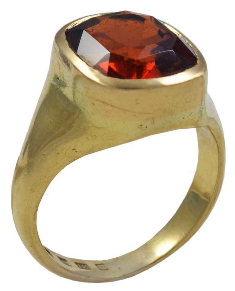 The strong Orange Garnet, weighting approximately 5 carats, mounted in 18kt Gold as a Signet Ring.
Condition: Good
This Ring will suit either a man or woman and looks very striking when worn on the pinky finger.
Discovered in Namibia in the