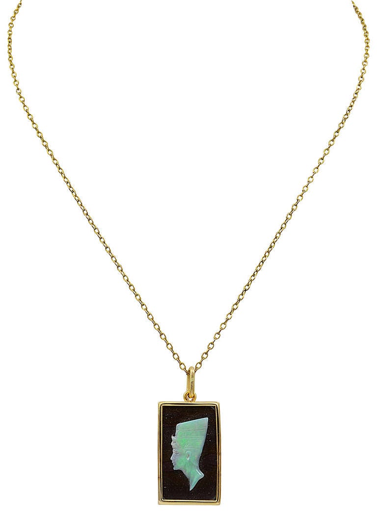 Mounted in an unmarked 18kt Gold frame and measuring 1 inch long x 1/2 inch wide. There are a few small fissures in the matrix but the Opal is in good condition.
Queen Nefertiti may have been the mother of Tutankhamun.
The Gold Chain is not