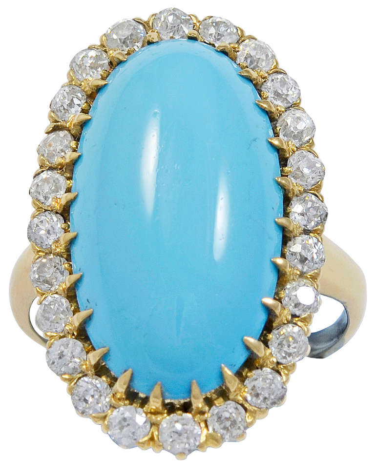 Die lange ovale persische Türkis von guter Farbe und mit einer Umgebung von vierundzwanzig alten Mine Diamanten, der innere Schaft gestempelt 14kt.
Fingergröße:   7  USA   N 1/2  UK    14  Japan
Abmaße:  26 mm hoch x 15 mm breit
Amerikanisch:  um