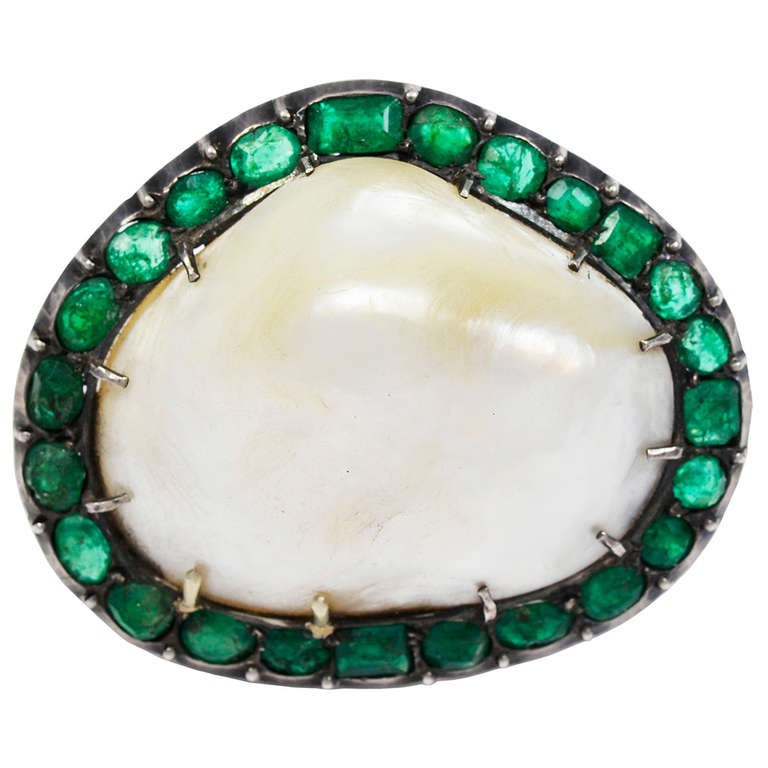 An Antique Natural Baroque Pearl & Emerald Brooch