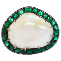 An Antique Natural Baroque Pearl & Emerald Brooch