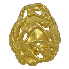 A large topped Gold Ring of pierced Foliate Design