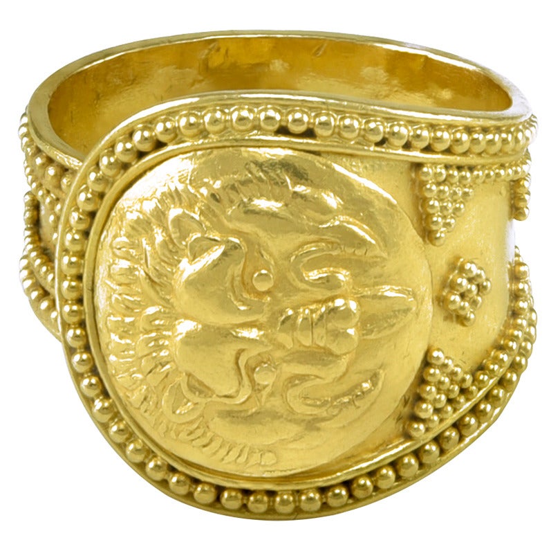 Made by Ilias Lalaounis and no doubt inspired by an original model in his Athens Museum. The Ring features the mask of a lion, which the original jeweller had probably never seen and was based solely on description.
The borders of the Ring are