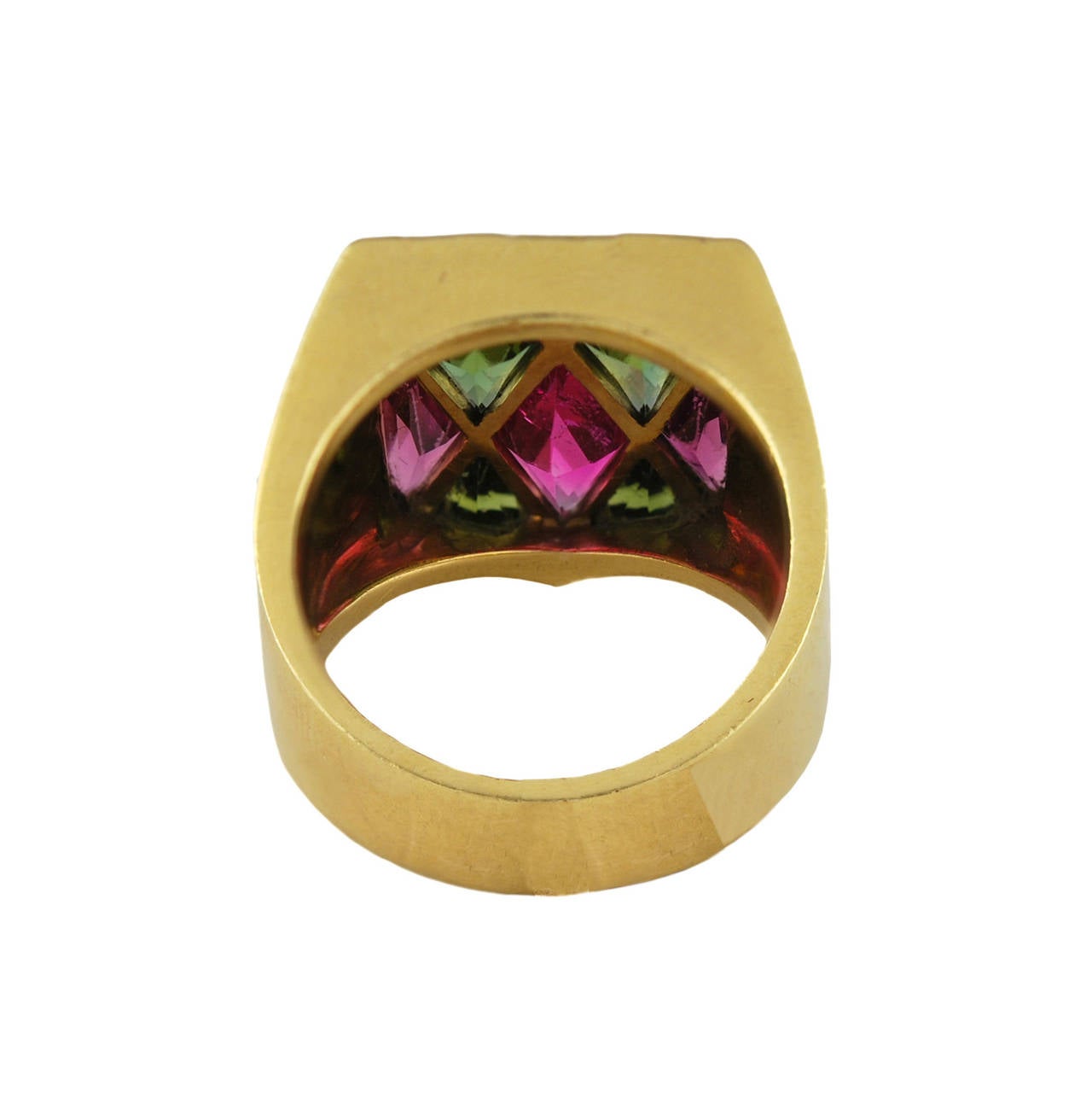 The stones mounted in a Harlequin pattern and is, I am told, the heraldic crest of an Italian Count and was made in the 1950's.
The unmarked Gold tests for 18k and the pink and green combination is most attractive. Some of the stones are lightly
