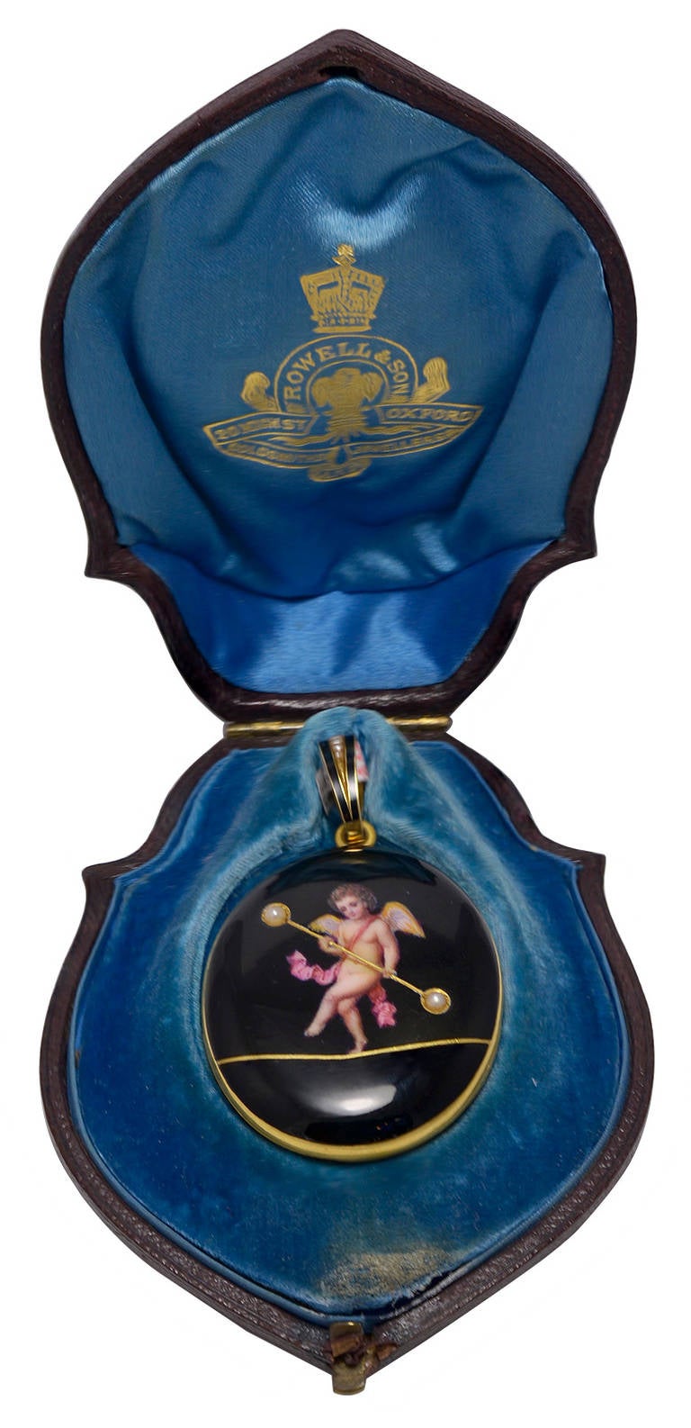 Portraying Cupid walking a Gold Tightrope, holding a balancing pole set with a half Pearl at either end and inside is a double glazed compartment and the Locket has the original Pearl set bale. Good condition but with two tiny blemishes on the