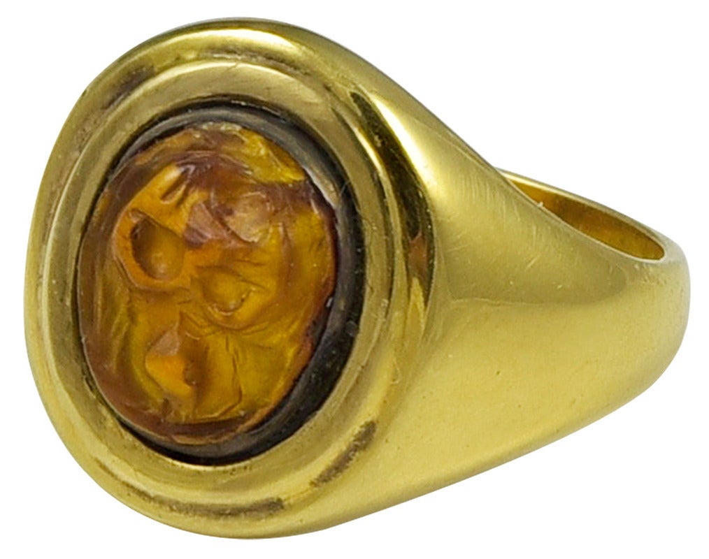 This is a very small Gold Ring, inset with what I think is an Ancient Egyptian carving of Thoth's sacred animal, the Baboon, which measures 9mm long x 8mm wide. The unmarked ring mount tests for 18k Gold and the simple Signet Ring style is mid 20th