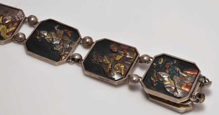 Victorian A Japanese Seven Panel Shakudo Work and Silver Bracelet