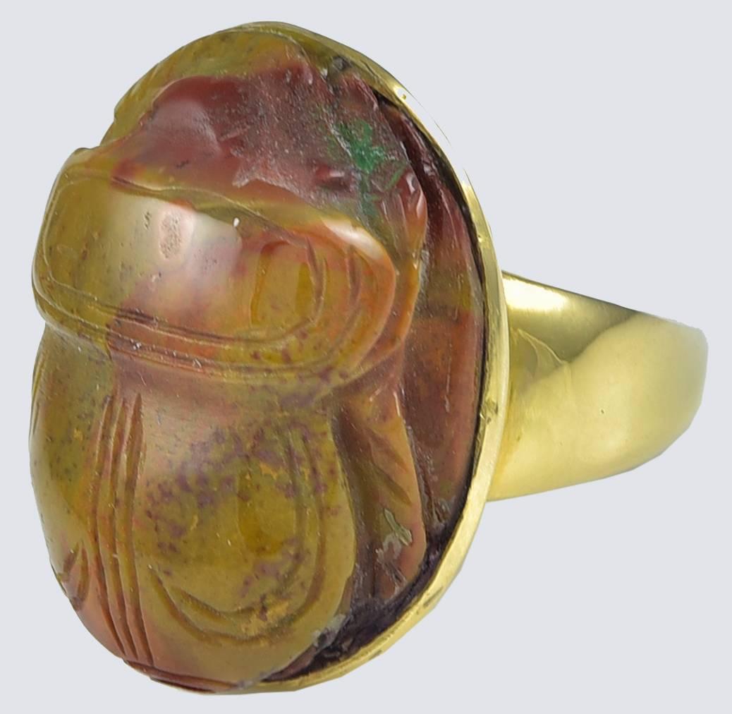 Set in a later closed back Gold ring mount to plain shoulders and unmarked
substantial shank testing for 18k Gold.
There is some slight chipping on the edge to the right of the head but little noticed and does not detract from the quality of the