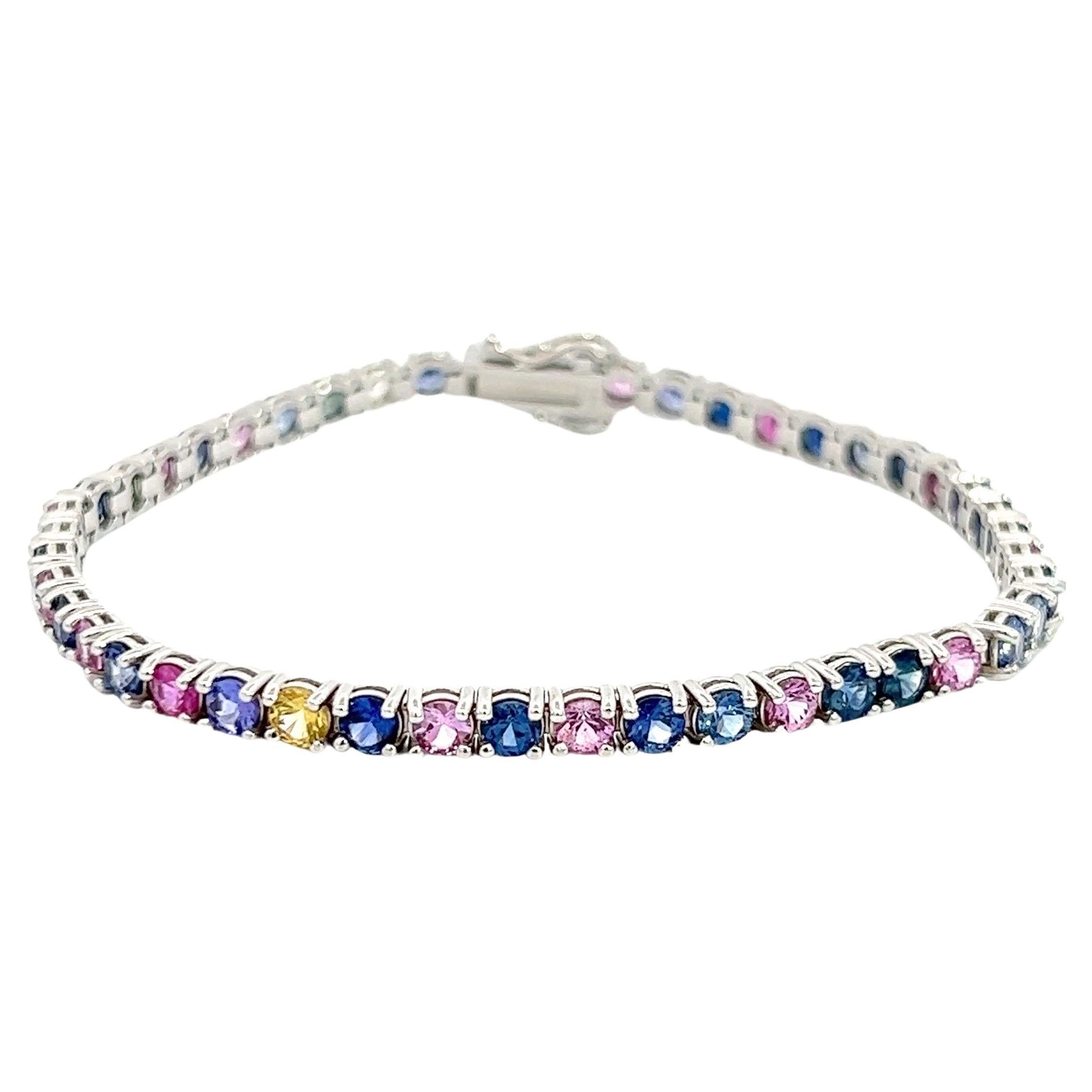 Natural Multi-color Rainbow Sapphires Tennis Bracelet
The Brilliant Color Sapphires will give you a boost of joy in any moment of your life.
14k White Gold
Number of Sapphires: 46
Total Sapphires Weight: 7.53 Carats
Bracelet's Length: 7' inches 
