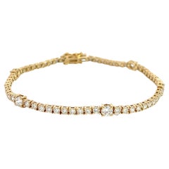 Bracelet tennis en or jaune 14 carats avec 5 diamants plus gros et un look unique