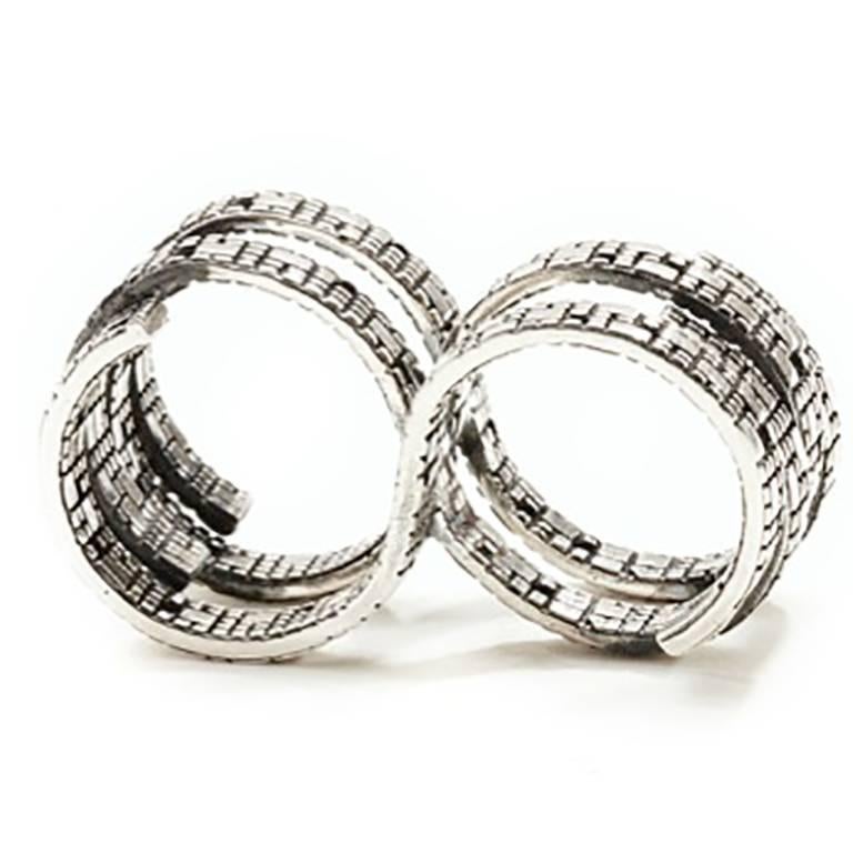 This unique, Detailed Fabri Double-Loop Sterling Silver Infinity Ring is a representation of the endless life cycles. With symmetrical designs and divine balance, this utterly unique silver jewelry ring exhibits new style and sensation that