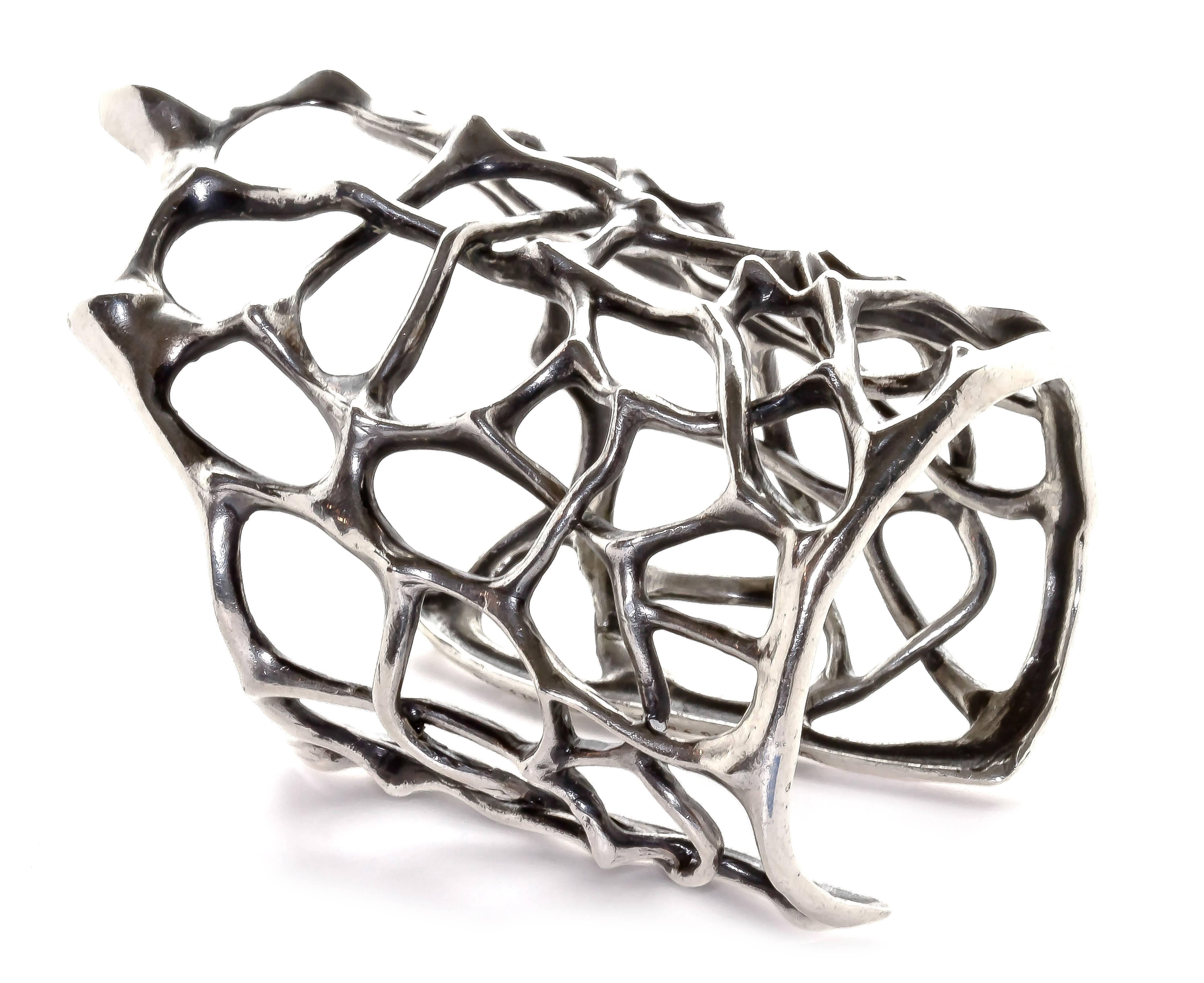 This sterling silver, thorn cuff arms the wearer with strength. This unique cuff is a limited edition John Brevard piece that evokes the interconnectedness of the natural world. The cuff is part of Brevard’s Morphogen Series. The Morphogen Series