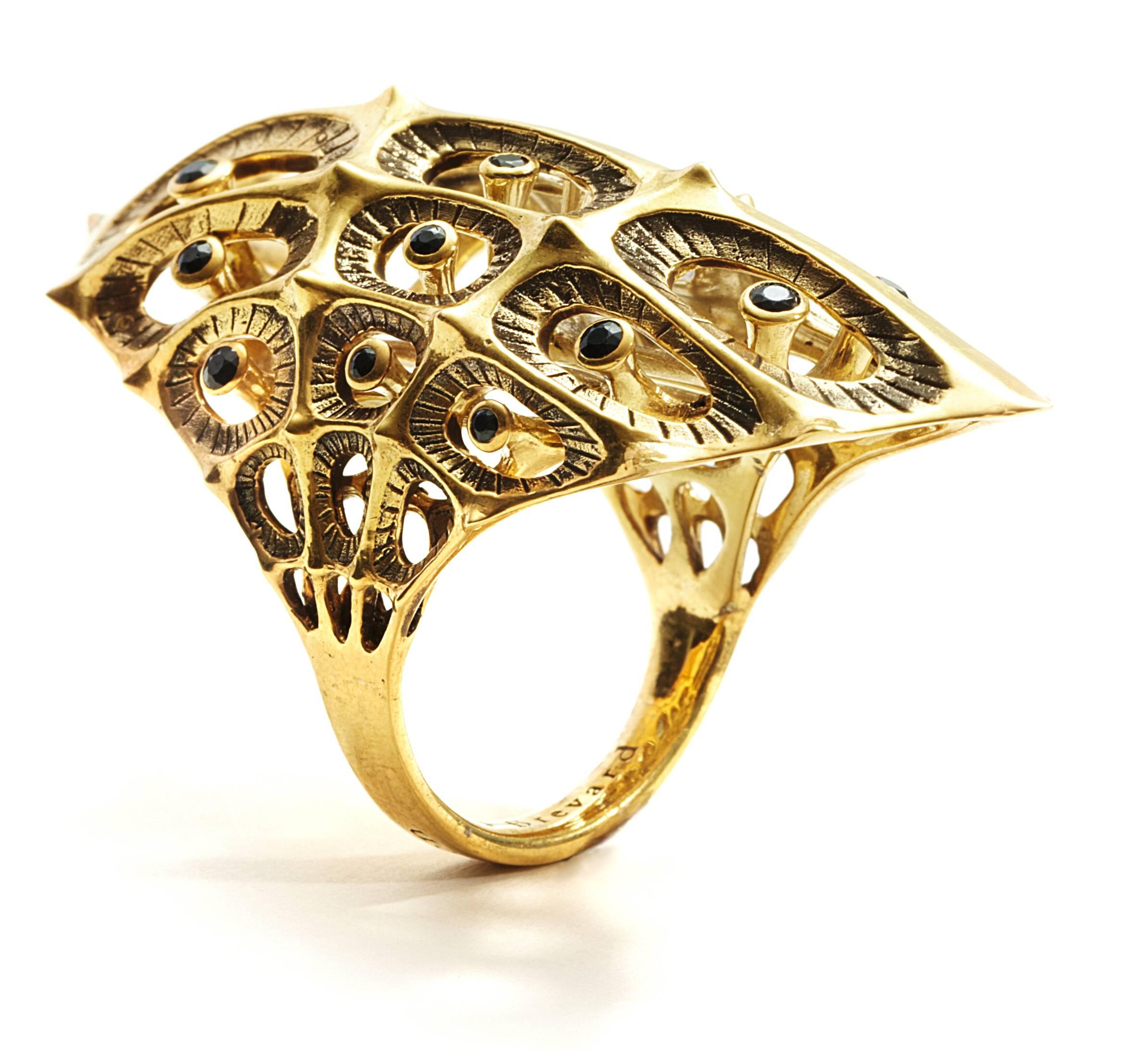 This unique Morpho Black Diamond and 18K Gold Ring is meant to evoke personal power. This limited edition piece is inspired by sacred geometries and patterns in nature. This sculptural ring is from designer John Brevard’s Morphogen series. The