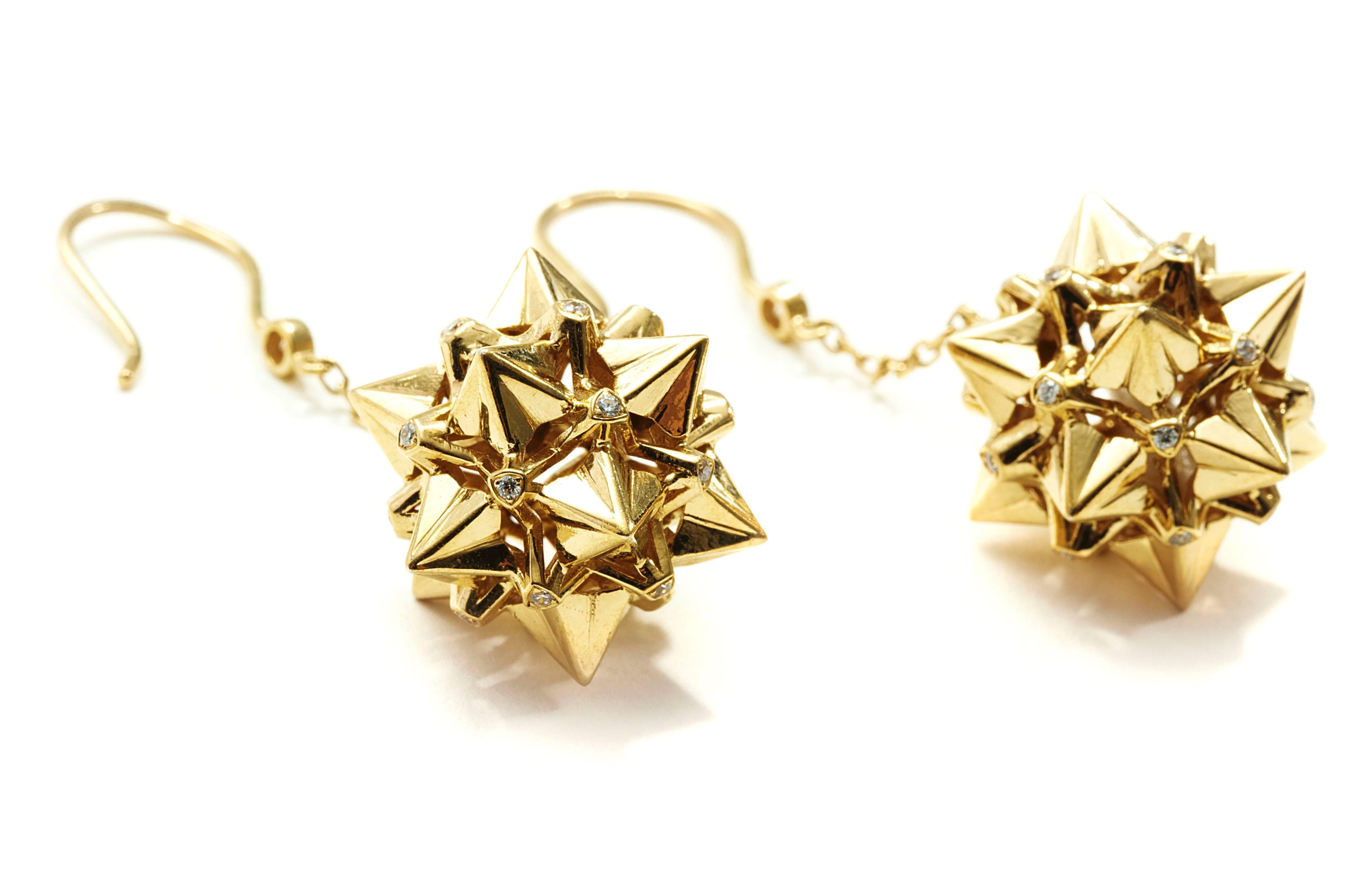 These Nova Diamond and 18K Gold Dangle Earrings are a statement of strength and power. Designer John Brevard used principles of sacred geometry to design these earrings for optimal strength and energy-capture. This piece is limited edition and