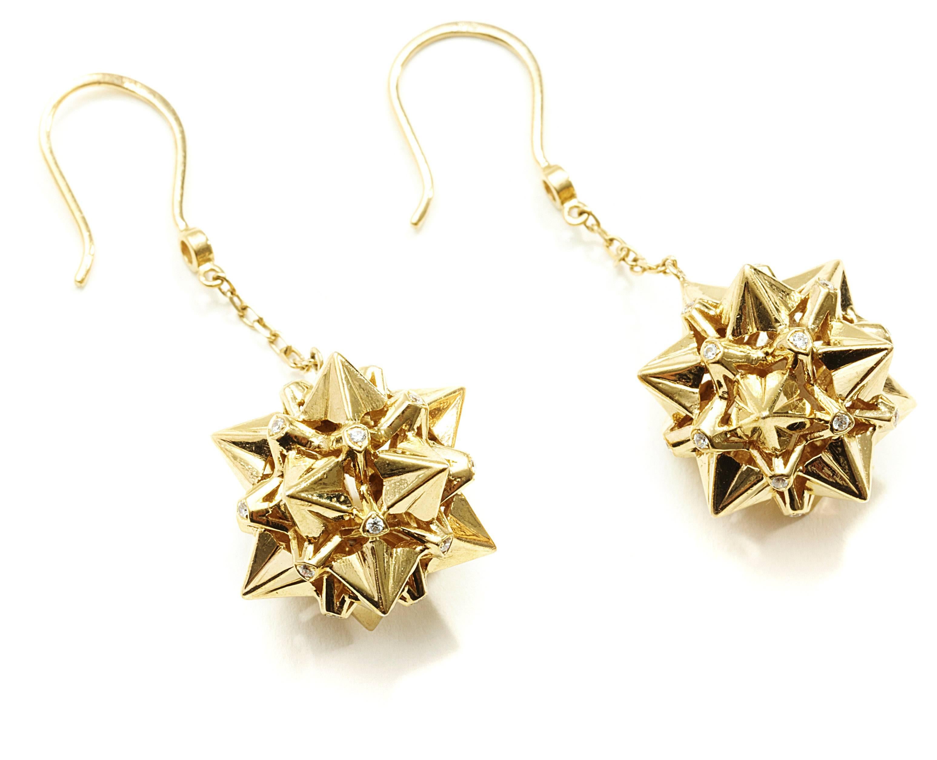 These Nova Diamond and 18K Gold Dangle Earrings are a statement of strength and power. Designer John Brevard used principles of sacred geometry to design these earrings for optimal strength and energy-capture. This piece is limited edition and