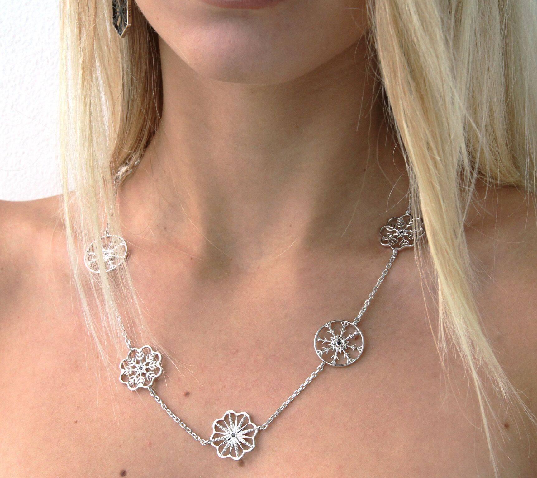 This elegant Snow Queen Long Necklace is a fusion of delicate beauty and inner strength. The necklace is made of sterling silver and features six black sapphires. This piece connects the wearer's life and the shape of a snowflake. Lives are