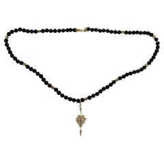 Temple Halskette aus 18 Karat Gold und Lavastein