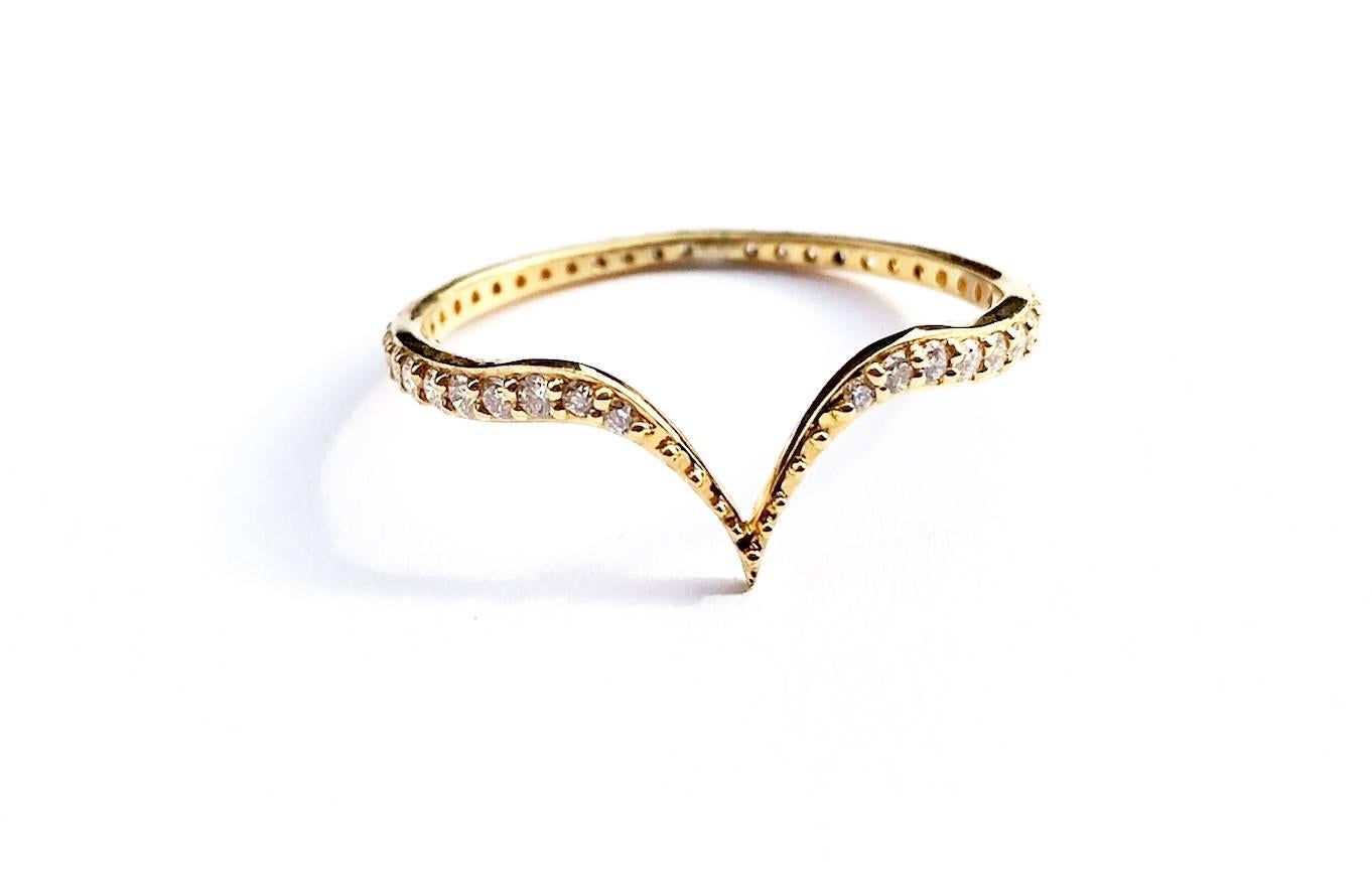 This limited edition, 18K Gold Fabri Stackable Diamond Ring is the simplest in the John Brevard collection. This elegant stackable gold ring is a fusion of delicate beauty and inner strength. The design is inspired by the heart shape and is