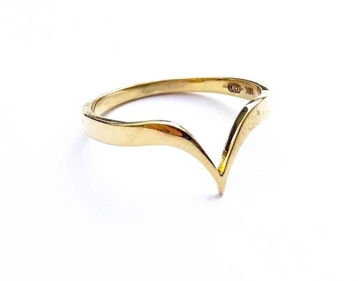 This limited edition, 18K Gold Fabri Stackable Ring is the simplest in the John Brevard collection. This elegant stackable gold ring is a fusion of delicate beauty and inner strength. The design is inspired by the heart shape and is available in