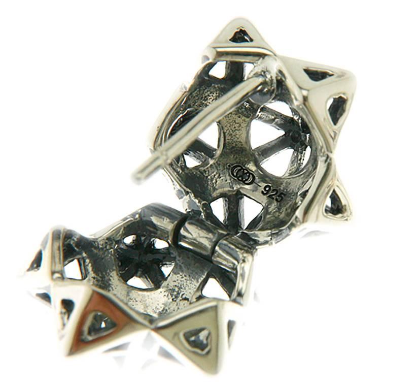 These limited edition, Framed Mini Tetra Sterling Silver Earring are an embodiment of monumental power and strength. These limited edition earrings by John Brevard are inspired by sacred geometry, namely the star tetrahedron. These sterling silver