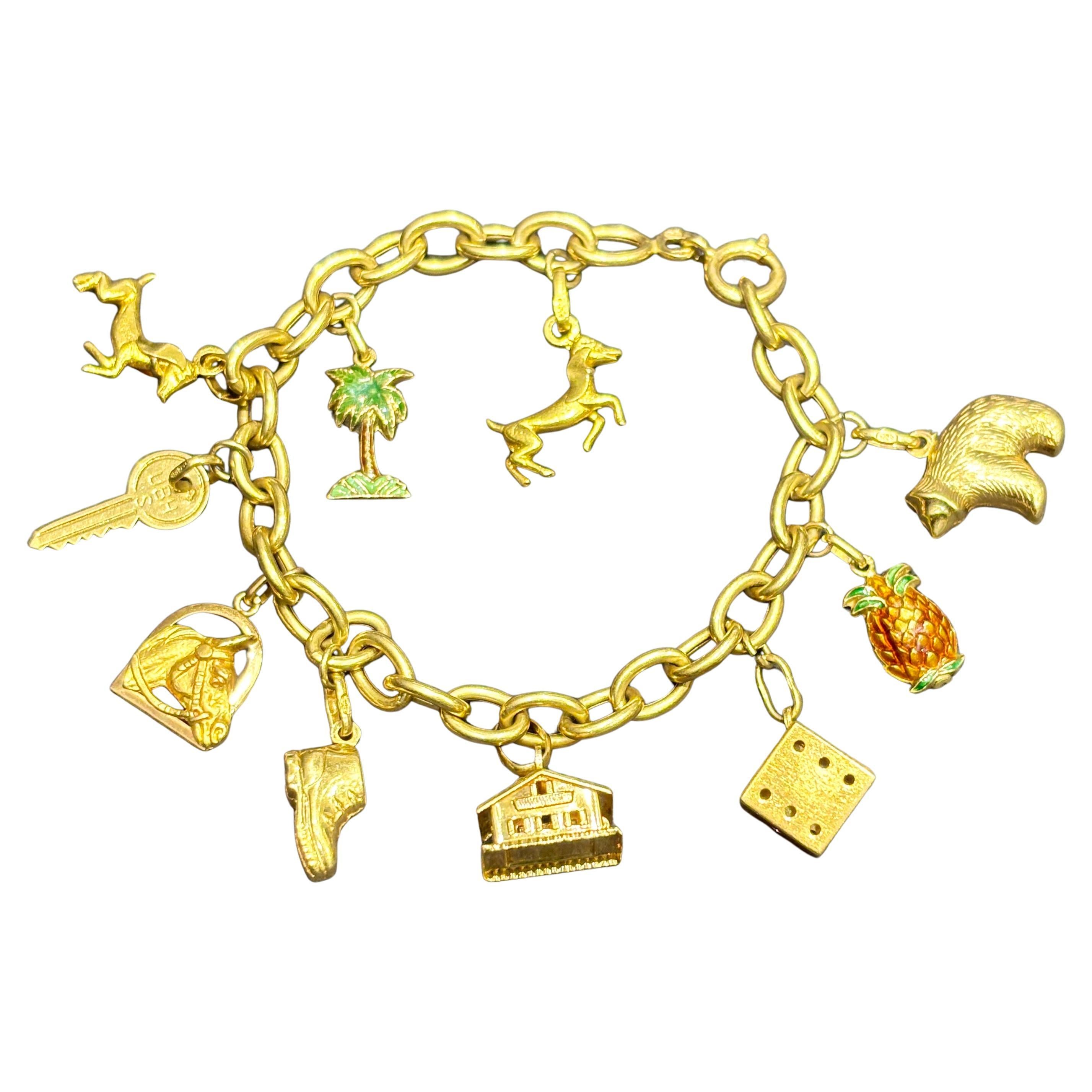 UnoAErre 1970 bracelet à breloques en or 18k avec 10 breloques originales estampillées en vente