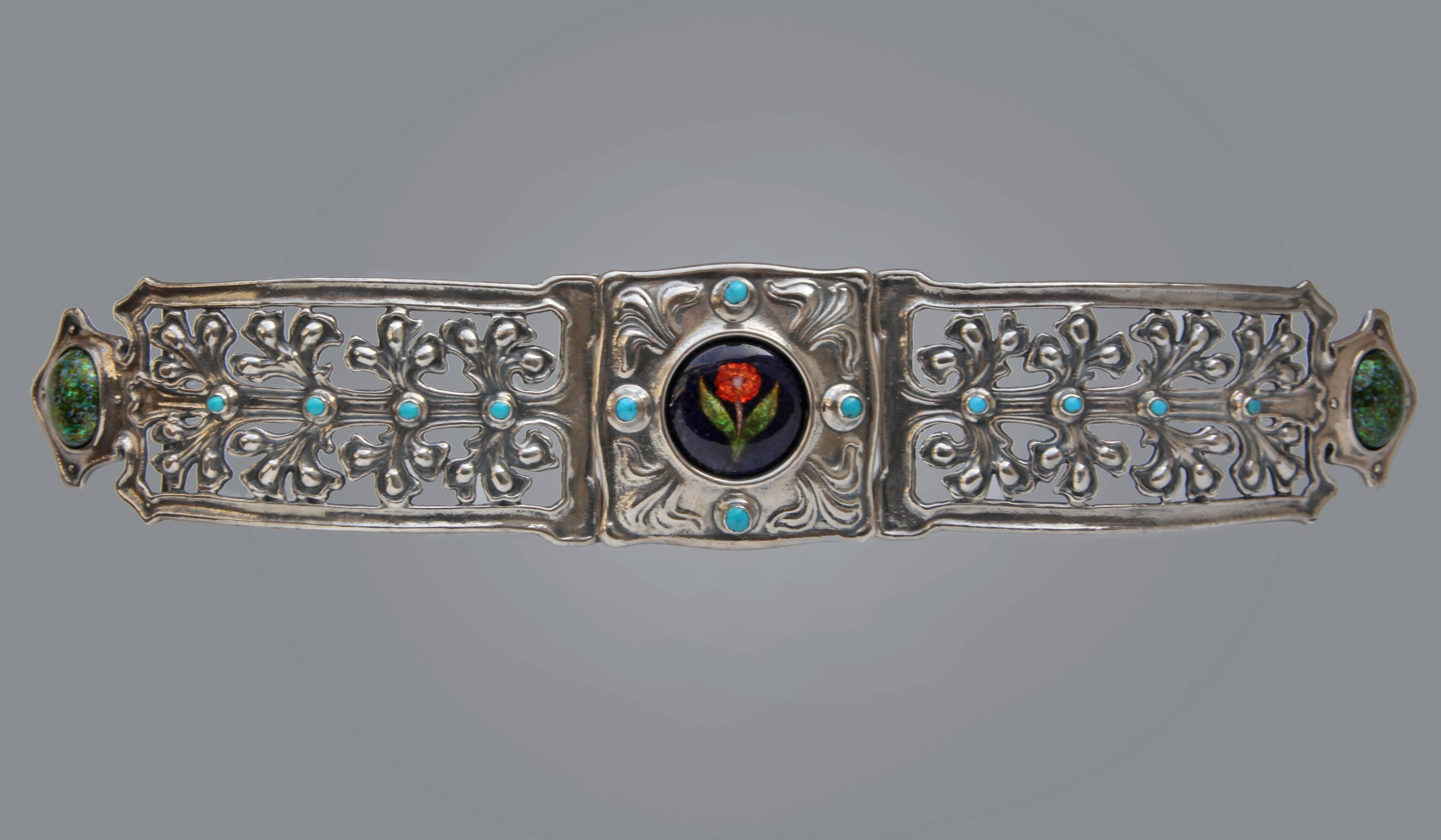 An important Arts & Crafts waist ornament by Nelson Dawson in silver, enamel & turquoise .
Signed verso: 'N.D'

