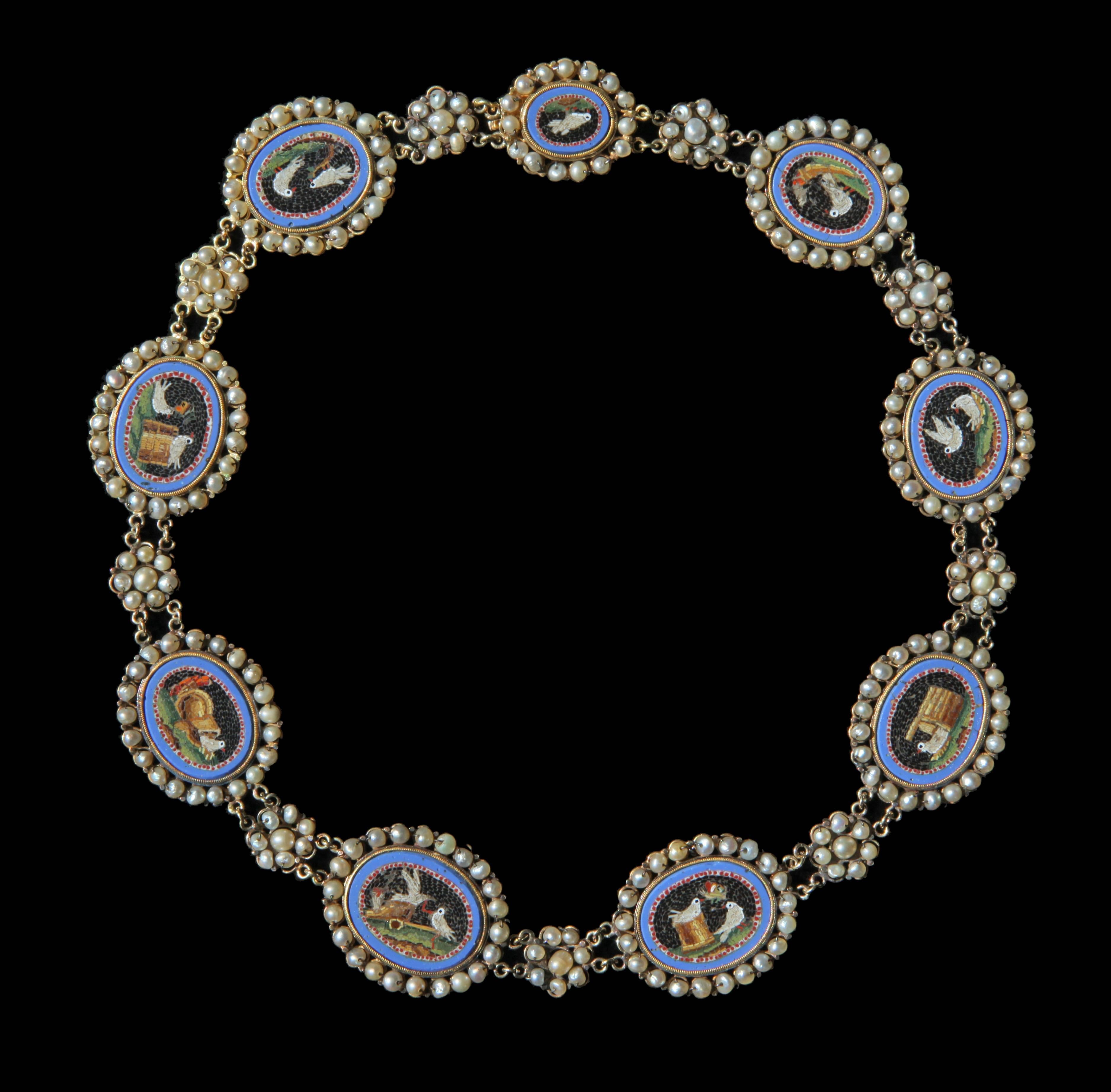 An exceptional Grand Tour antique necklace composed of 9 oval Roman style micro-mosaics, depicting Doves in the manner of the famous mosaics discovered in Emperor Hadrian's villa at Tivoli & described by Plinny in the 1st Century AD.
Mounted in