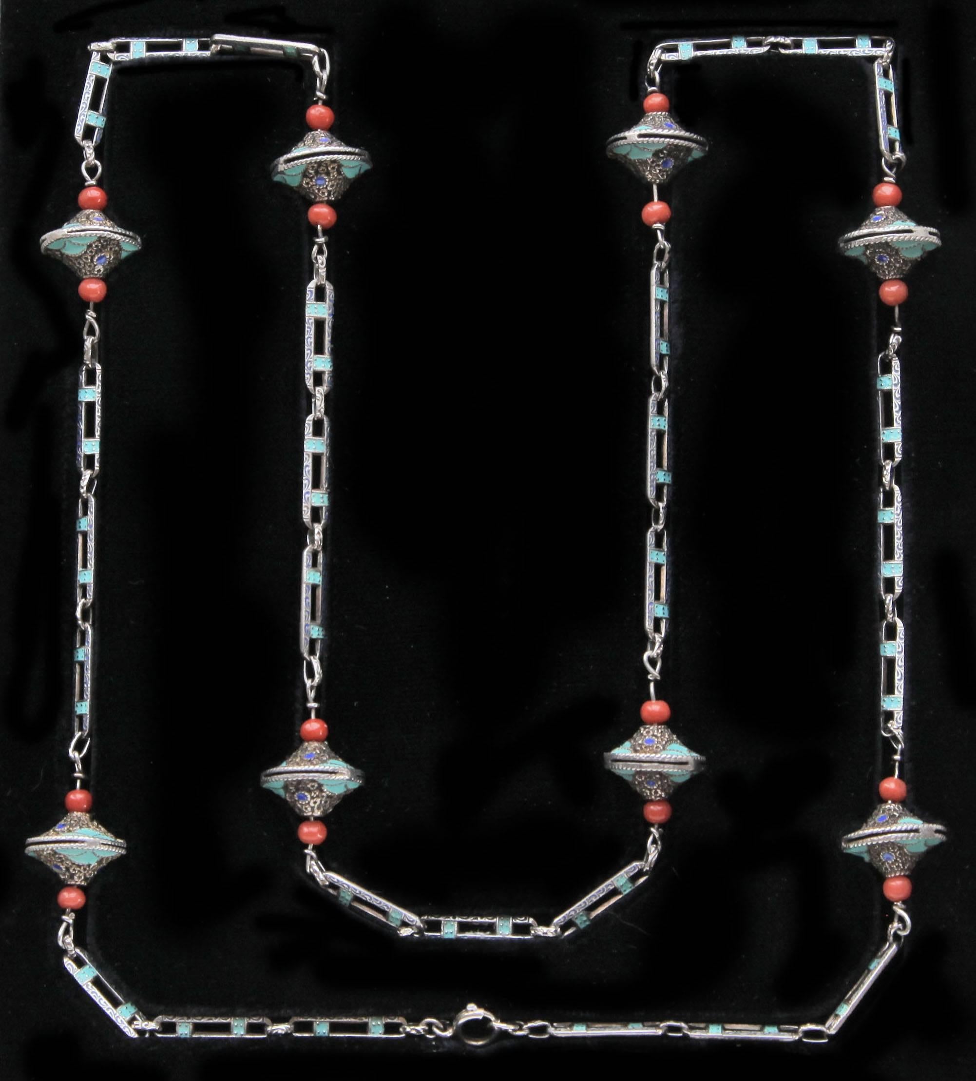 An important Theodor Fahrner Art Deco Sautoir by Gustav Braendle, ornamented with eight silver, enamel & coral decorative kreisels.
Signed:  'TF' & '935'