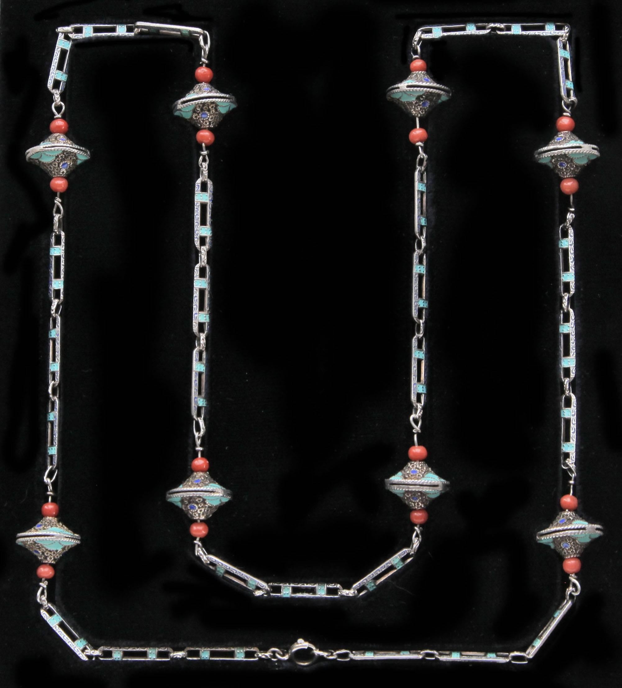 An important Theodor Fahrner Art Deco Sautoir by Gustav Braendle, ornamented with eight silver, enamel & coral decorative kreisels.
Signed:  'TF' & '935'