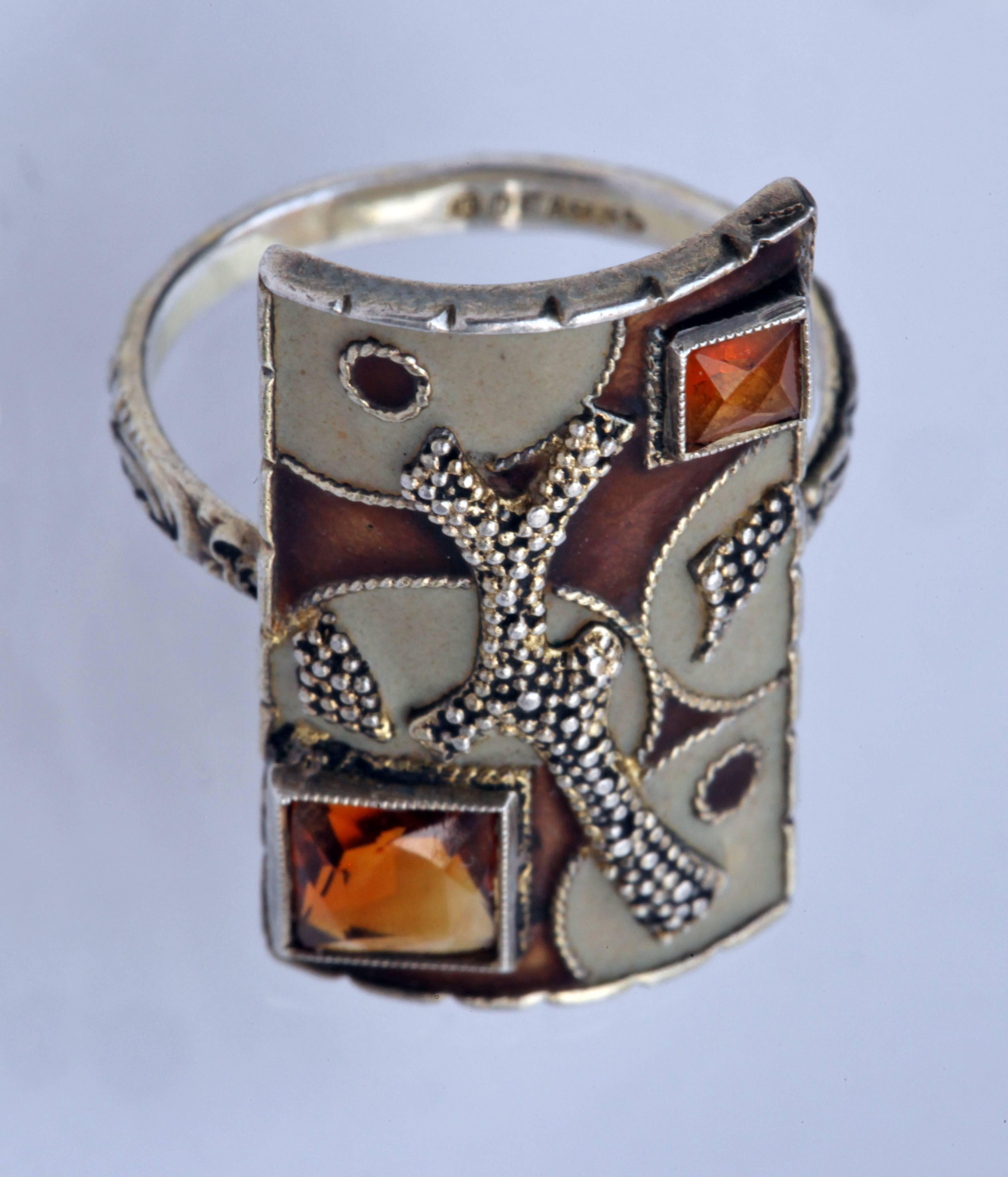 An avant-garde, spirited & vibrant take on cubist abstraction by Theodor Fahrner in silver, matt enamel & citrine
Probably influenced by the designs of the Ballets Russes
Ring Size: UK: O 1/2   US: 7.5   EU: 55.7   Asia: 15 
Literature: