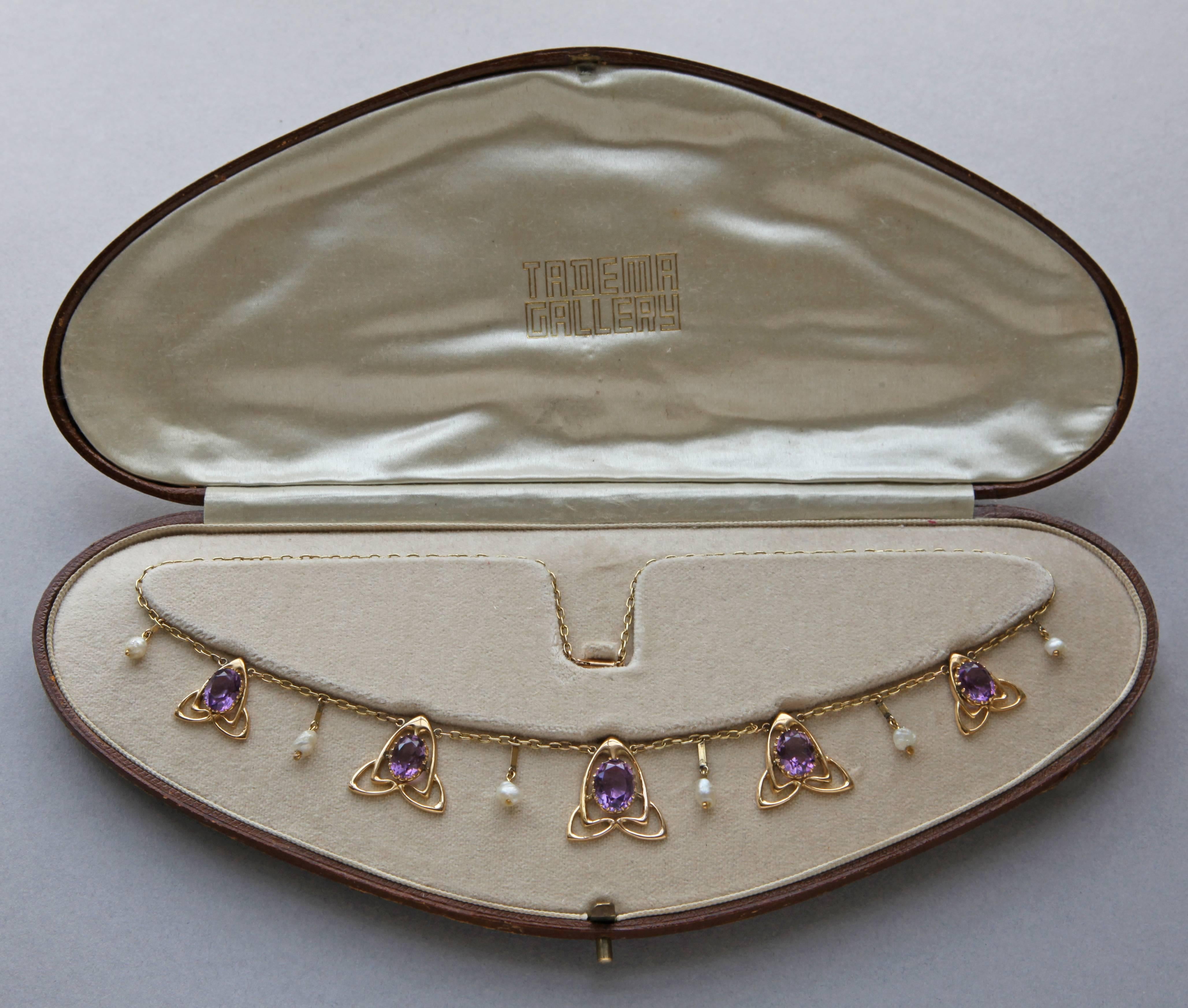 A lovely Liberty & Co Art Nouveau necklace in gold and amethyst designed by Archibald Knox
Documented: cf. Liberty Jewellery sketch book page 216, model number 8167
Archibald Knox, Stephen A. Martin, 2001, page 249. 
Fitted case 