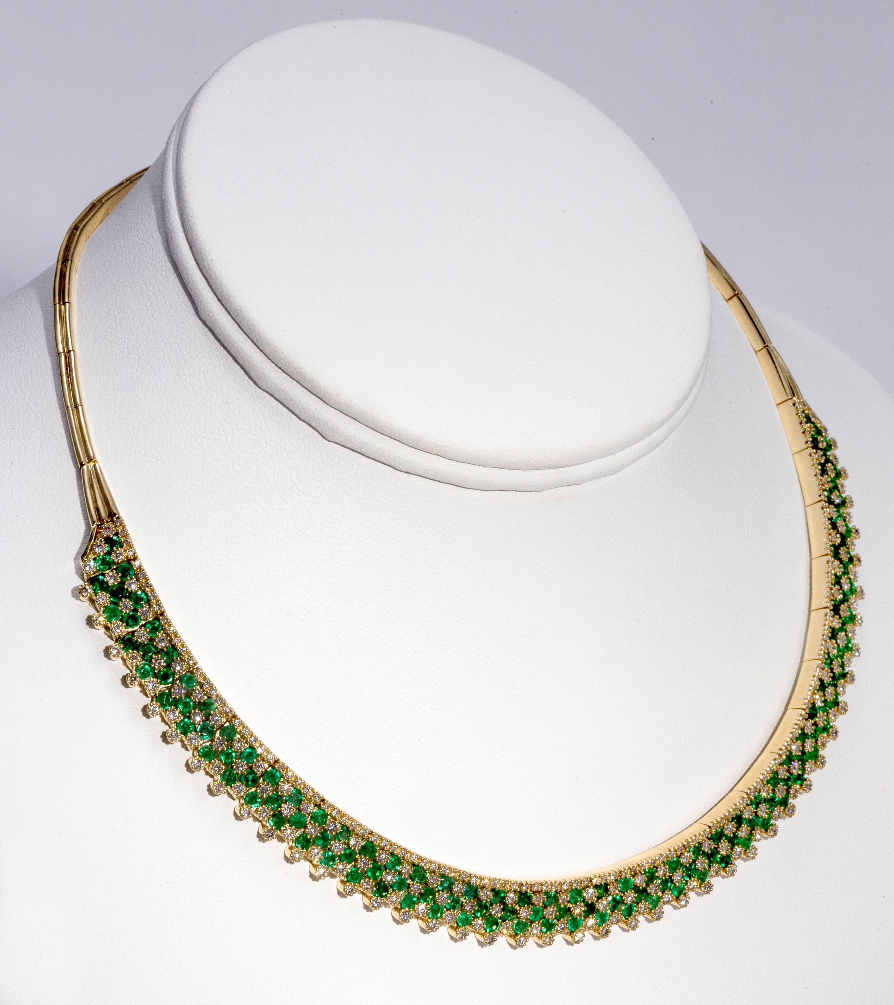 Very dramatic, dazzling  emeralds and diamonds necklace. 
 291 diamonds full cut- 3.5k
132Emeralds- 6.6 k
Flexible links with double safety latches.
Estate jewelry c. 1970s. In excellent condition.
