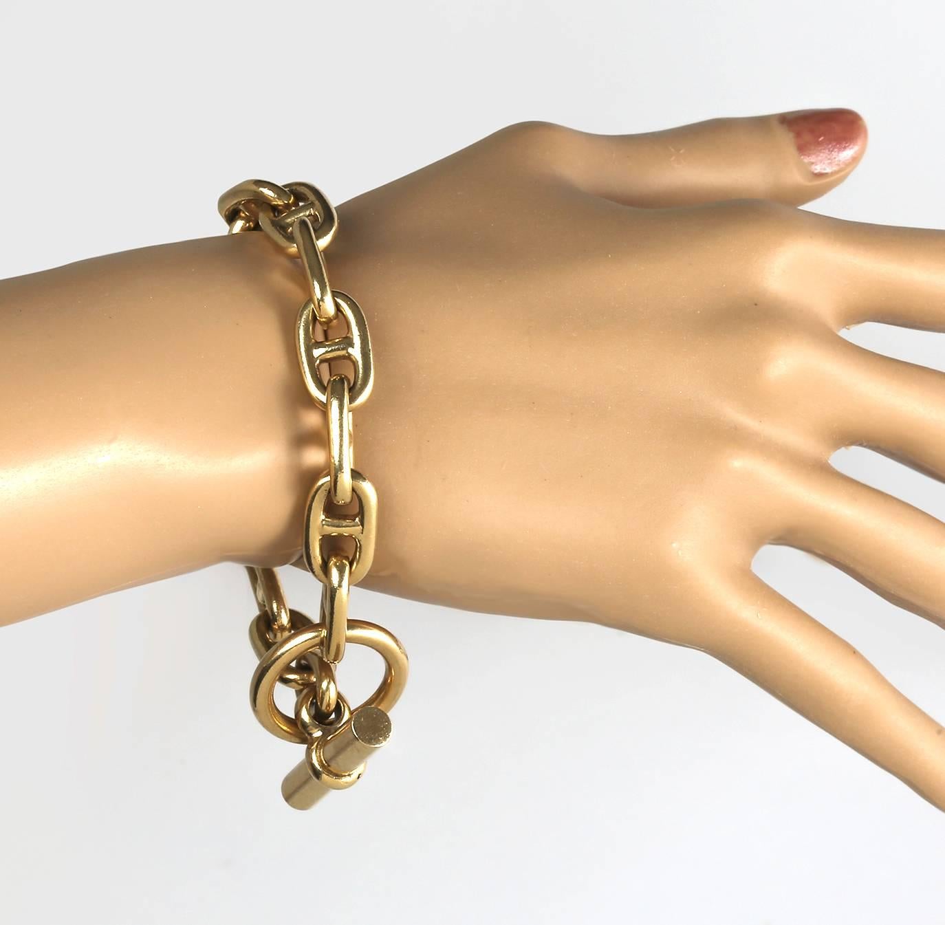 Lovely and warmly rich, custom made heavy solid 14k gold (tested) link bracelet. 
Ring and toggle clasp.  Ring is 1