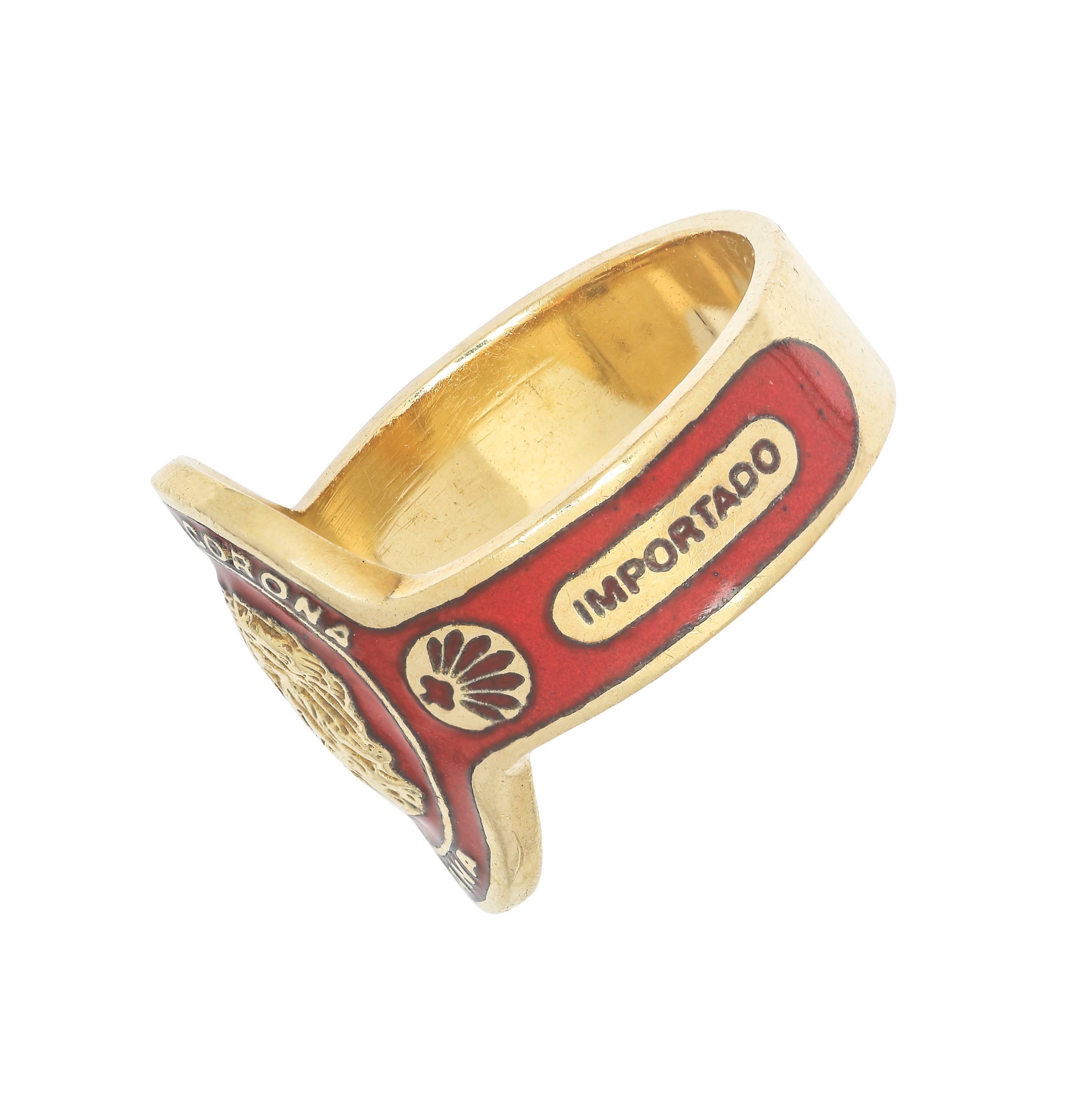 Signed Cartier 18k.  Red enamel Havana Corona cigar band ring.  Size 6
Excellent condition.