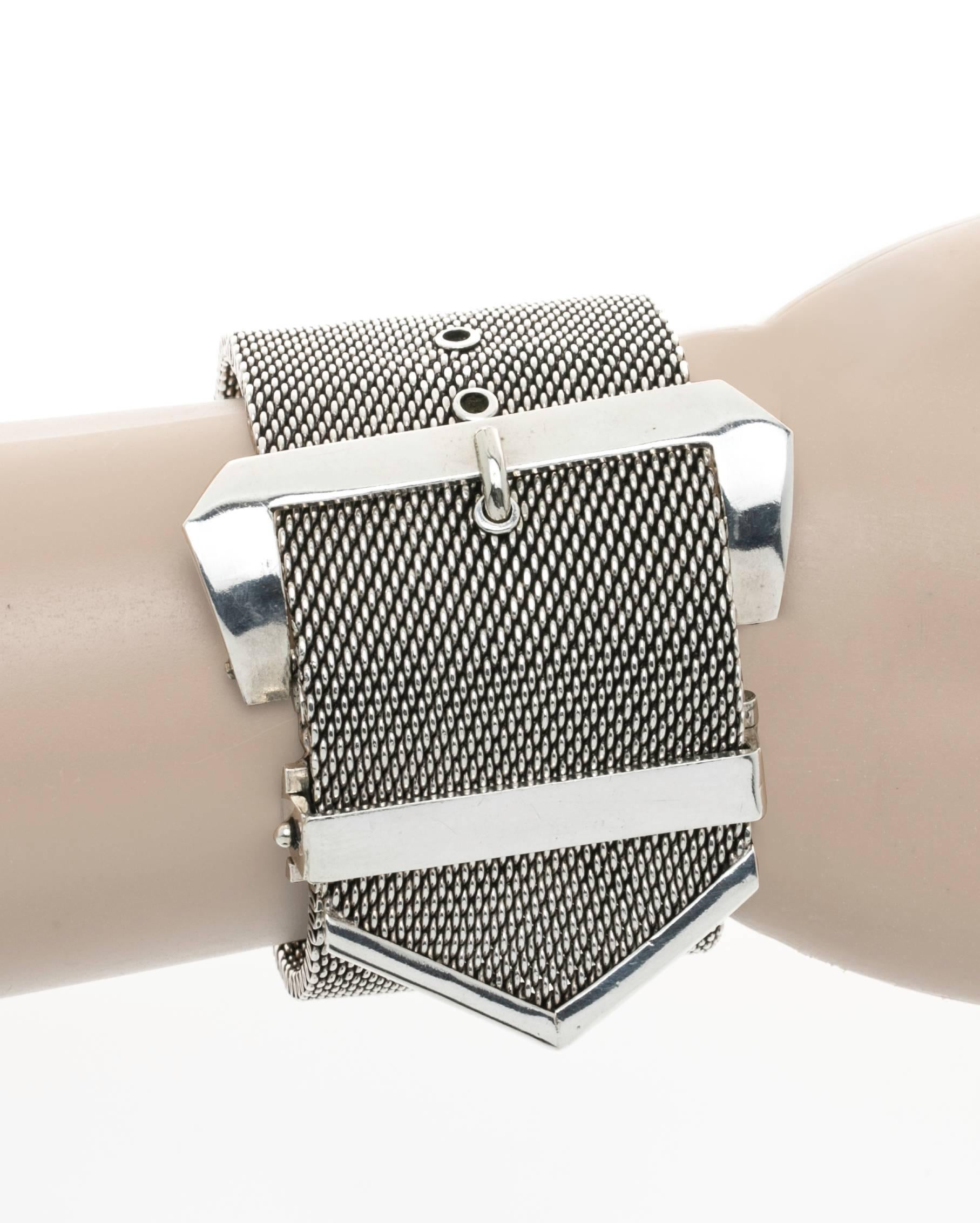 Dramatic heavy Sterling silver mesh style buckle bracelet.   Hinged safety closure. The band is about 1/8" thick.