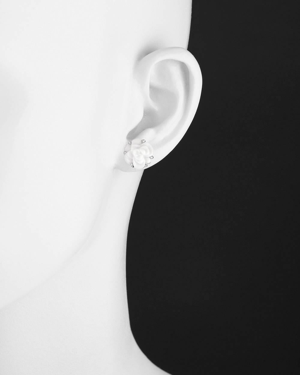 Camélia stud earrings, showcasing a carved white agate camellia flower motif, in 18k white gold, with posts and squeeze-style backs, signed Chanel. 0.5