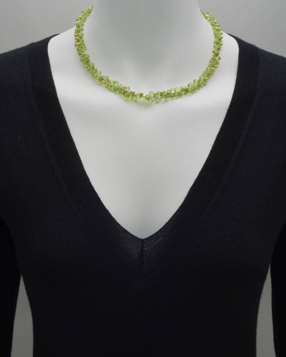 Briolette-cut peridot bead and 18k yellow gold bead collar necklace, secured by an 18k yellow gold toggle clasp, signed Marya Dabrowski. 17.5