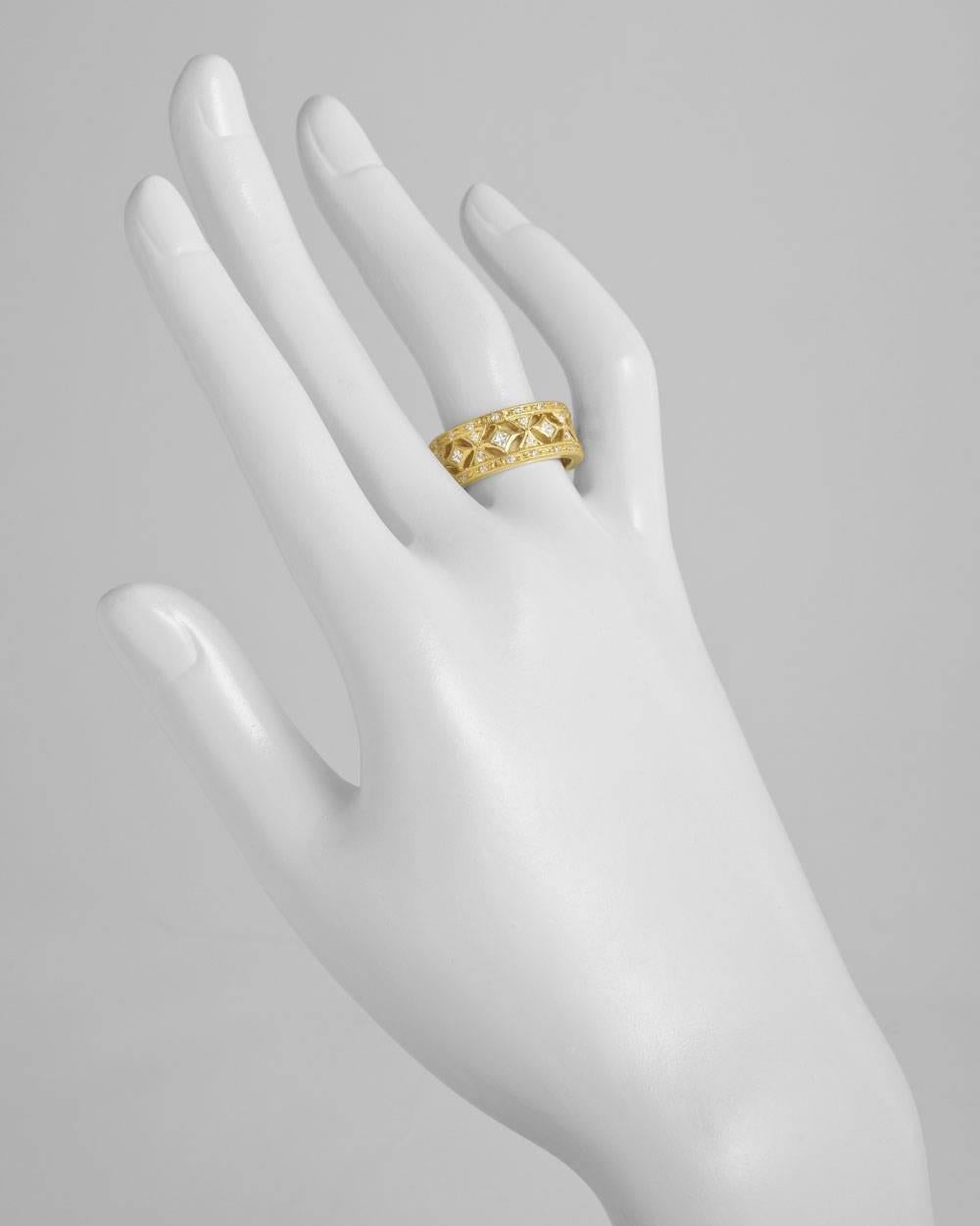 Wide openwork band ring in 18k yellow gold. Square and round-cut diamonds weighing 0.90 total carats. 9mm band width. Designed by Cathy Carmendy. Size 7.