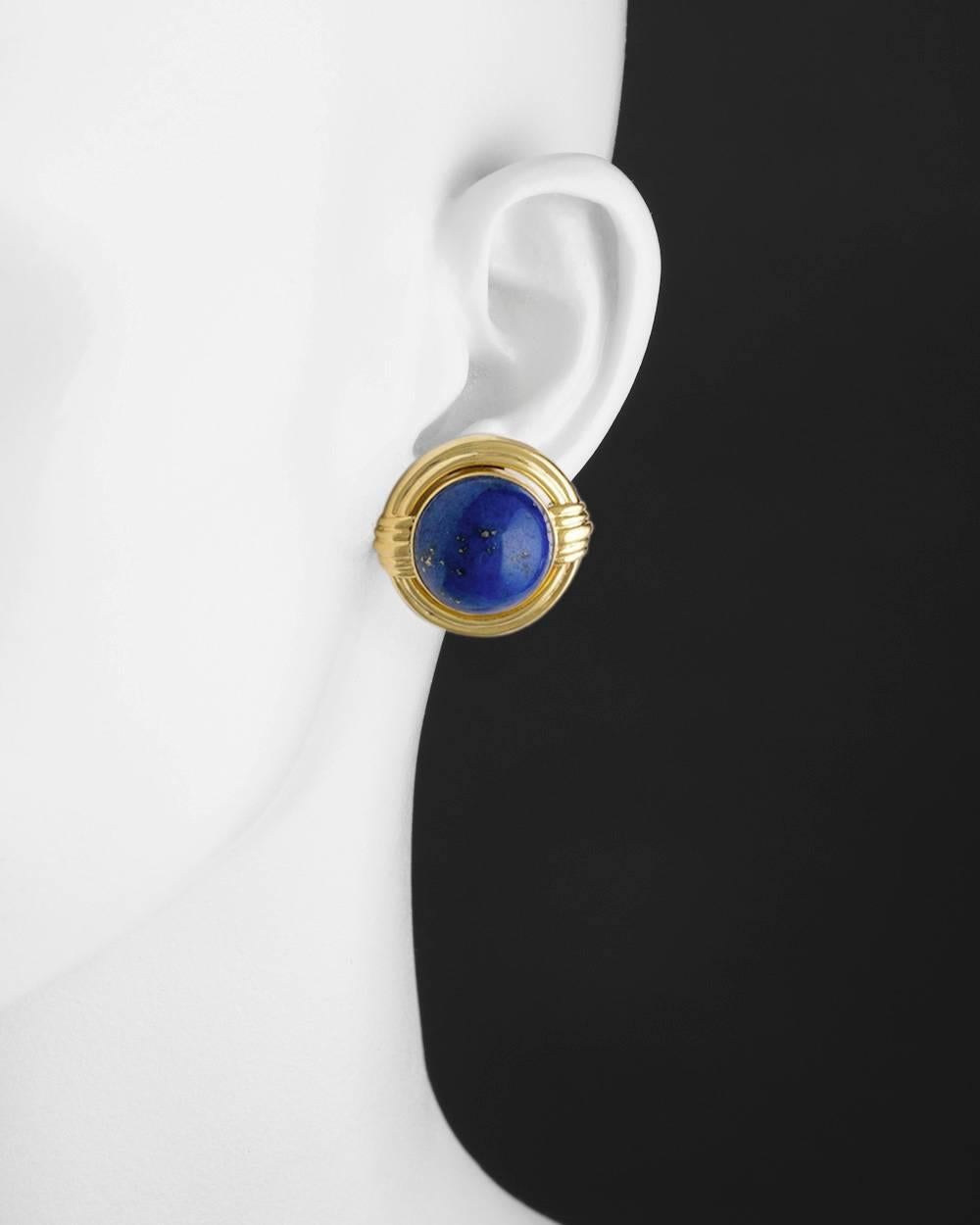 Round cabochon lapis lazuli earclips in 14k yellow gold, measuring 1