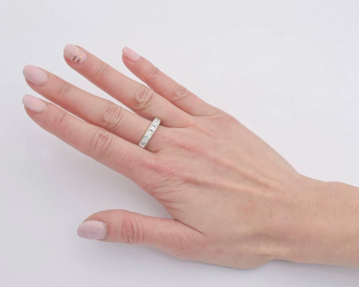 Diamond eternity band ring, showcasing square-cut diamonds channel-set in platinum. Twenty-three diamonds weighing approximately 4.00 total carats. G-H color, VVS clarity. 4mm width band. Size 8.
