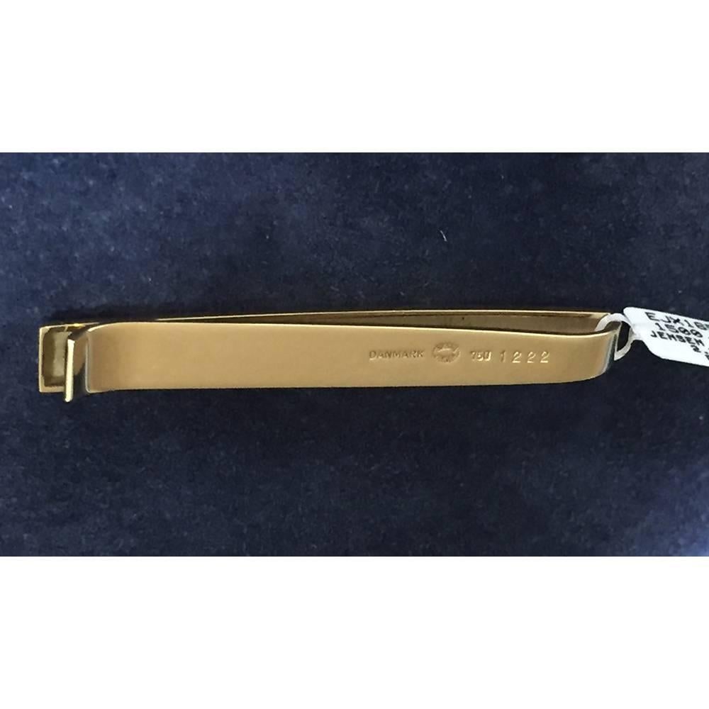 Classic tie bar in high-polished 18k yellow gold, marked Denmark 1222, signed Georg Jensen. 2.5