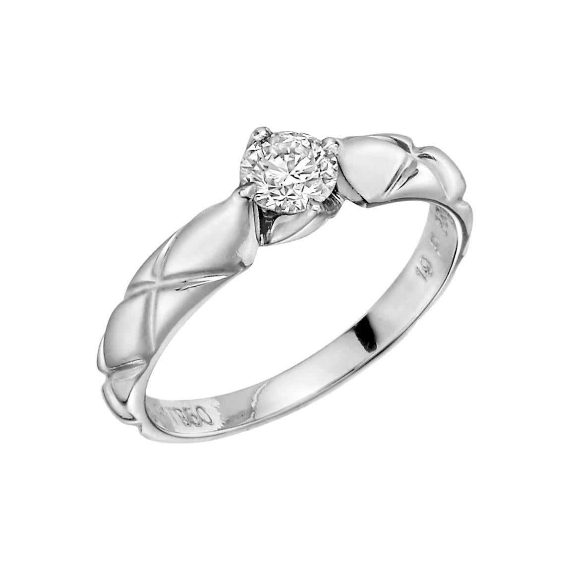 Matelasse diamond solitaire ring, designed with a band in a quilted pattern band set with a single round brilliant diamond, in platinum, style number 3392, signed Chanel. Diamond weighing approximately 0.38 carats. Ring size 6.