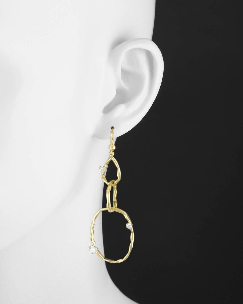 Triple hoop pendant earrings, each designed as three graduation interlocking hoop links suspended from a French wire and accented by circular cut diamonds, in 18k yellow gold, signed Mimi So. Six diamonds weighing approximately 0.90 total carats
