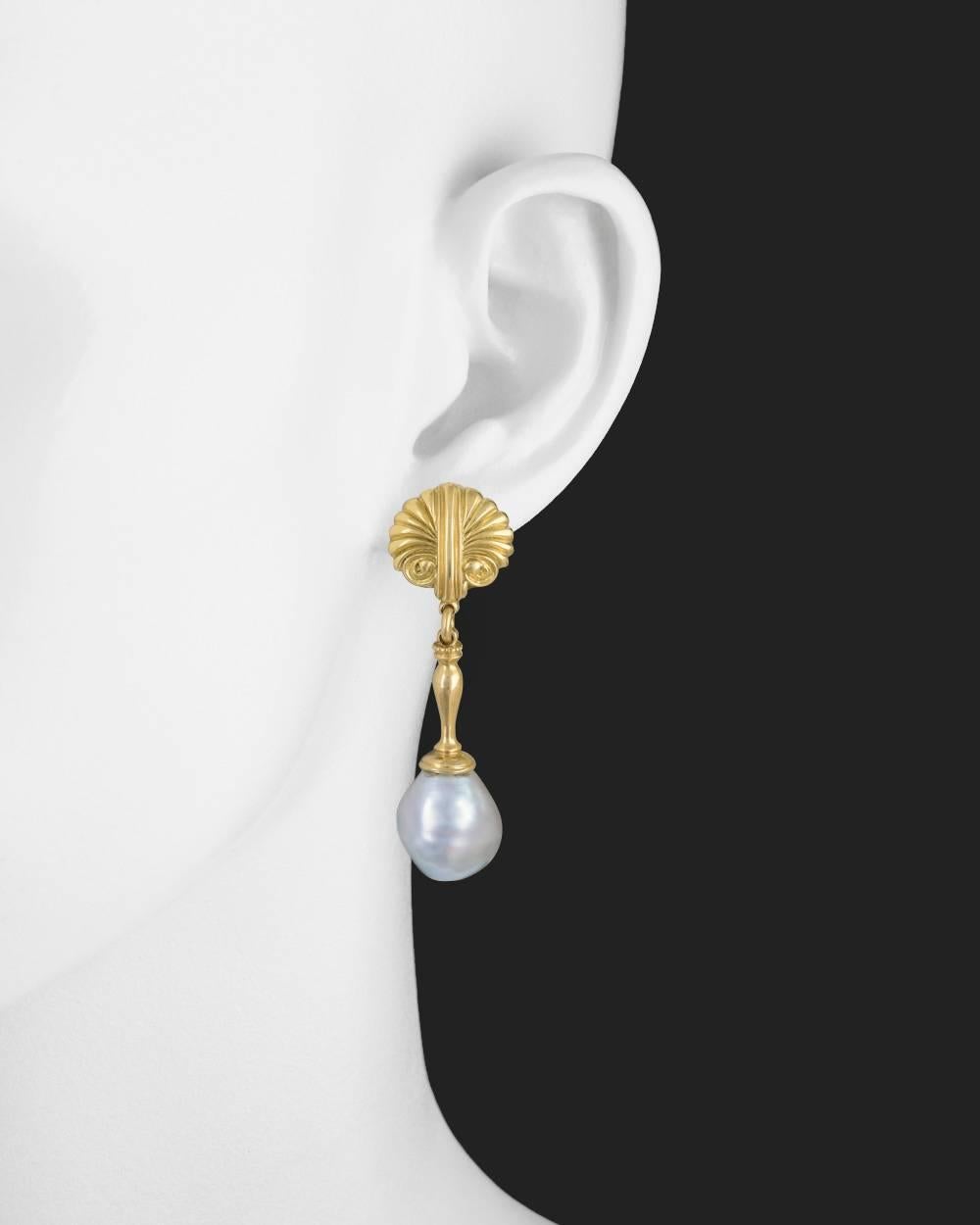 Pendant earrings, showcasing gray-toned baroque pearl drops measuring approximately 13mm in diameter, suspended from scallop shell motif tops with tapered column-style links in 18k yellow gold. Clip backs. 1.9