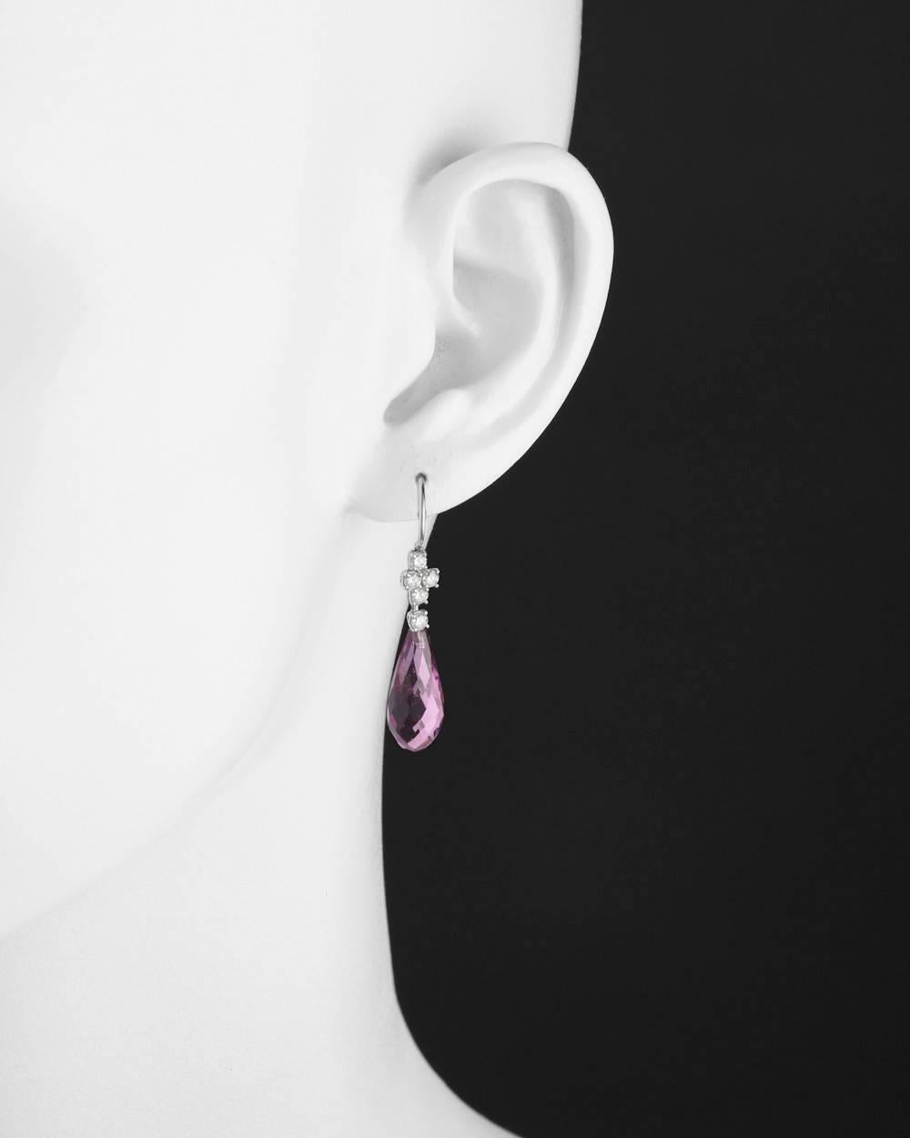 Pendant earrings, showcasing a pair of briolette-cut pink tourmaline drops weighing 13.56 total carats, with a diamond cluster surmount composed of ten round diamonds weighing 0.50 total carats, on French wires, in platinum. 1.4