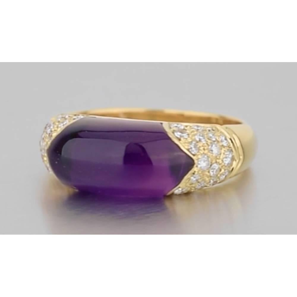 Dress ring, centering an elongated cabochon-cut amethyst flanked by pavé-set round-cut diamond shoulders, mounted in polished 18k yellow gold, signed 'BVLGARI'. Size 6.5.

