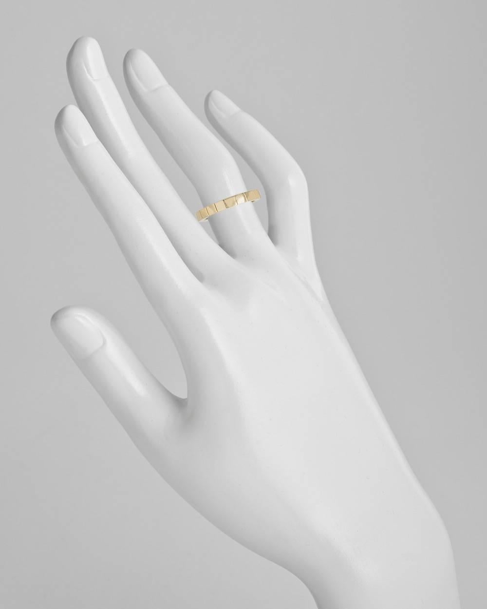 "Lanières" slender band ring, designed as a continuous sequence of square motifs, in high-polished 18k yellow gold, numbered AJ7627 and signed Cartier. 3mm band width. Size 5.25 (50 - European). This ring cannot be resized.
