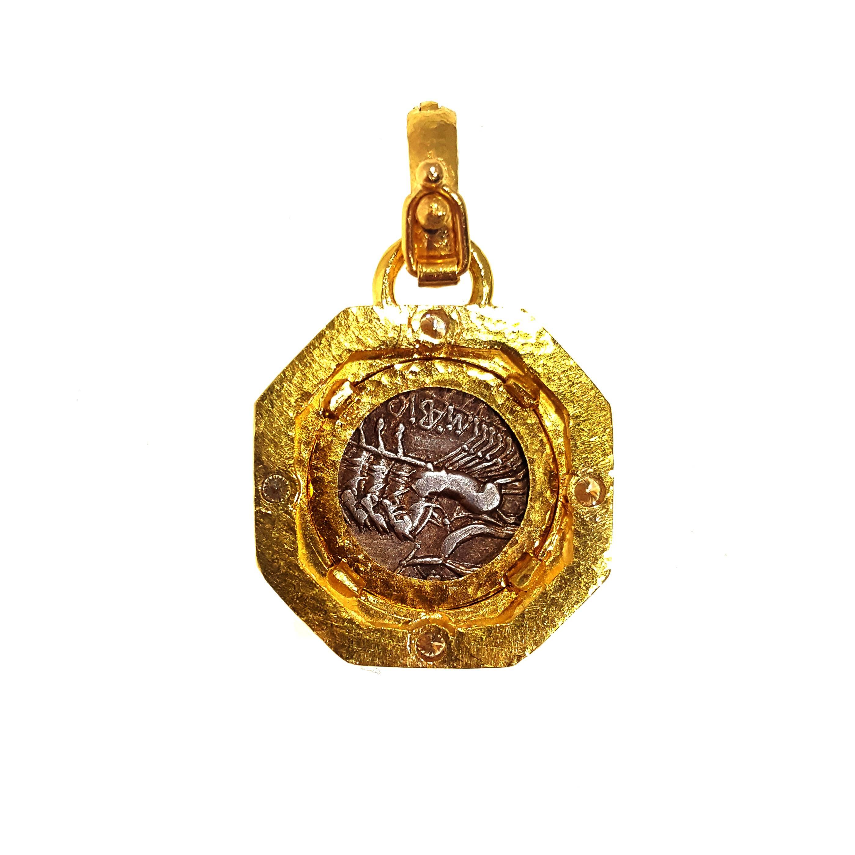 Elizabeth Locke 19kt yellow gold pendant with ancient coin and diamond accents. Pendant features a hinged bail and luxurious hammered texture, and measures approximately  1 inch by 1 inch with a 16mm coin.  Chain sold separately. 