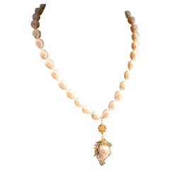A long freshwater baroque pearl necklace with a  large freshwater pearl pendant