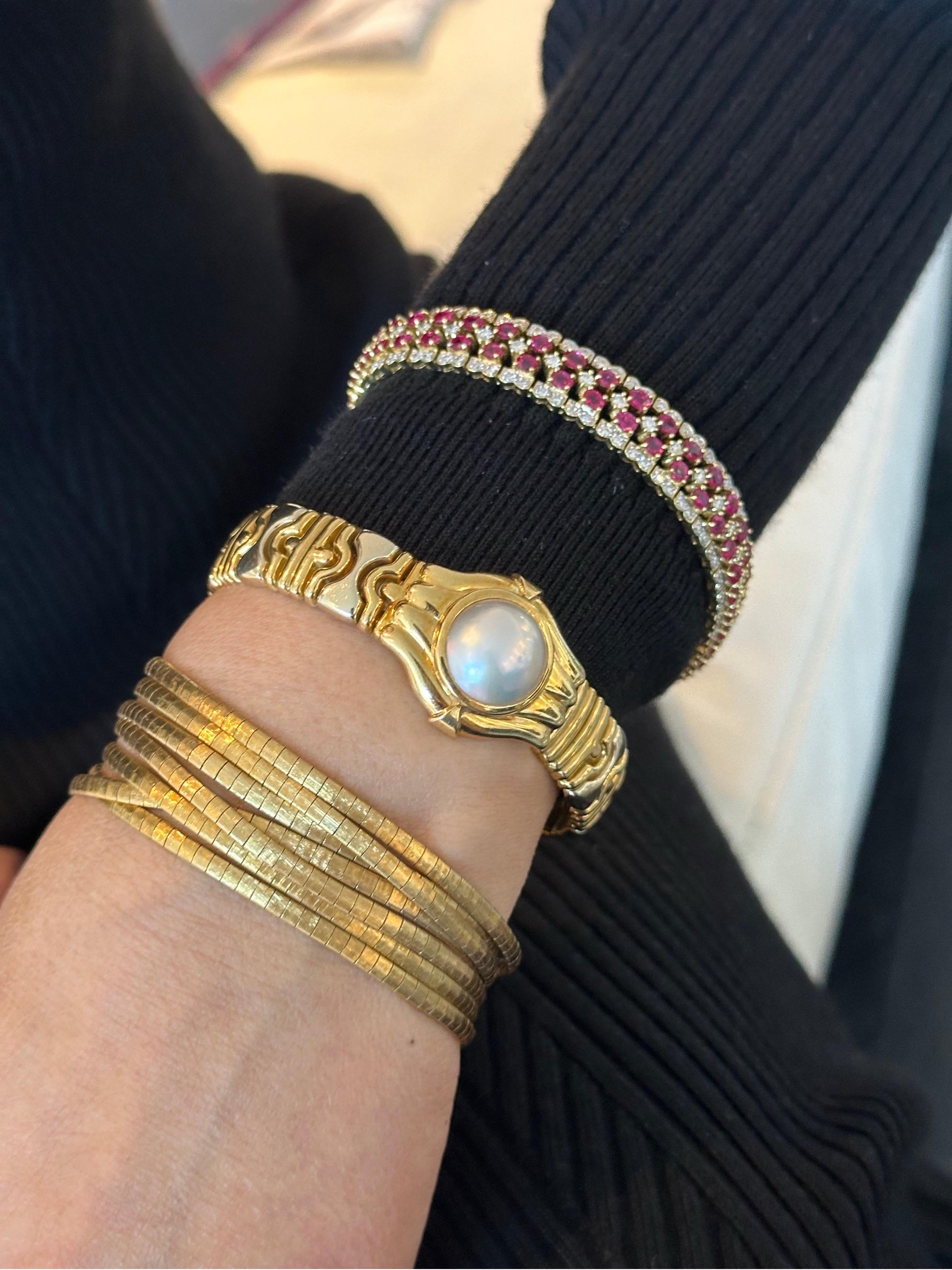 Metal: clap is 14K solid gold, the remaining is 18K solid gold. 
Bracelet length: 7 inches.
Natural Ruby weight: approx. 5.00 ctw.
Natural Diamond weight: approx. 2.5 ctw.
Diamond color: H-I.
Diamond clarity: SI1-SI2.
Total weight: 36.66 grams.
